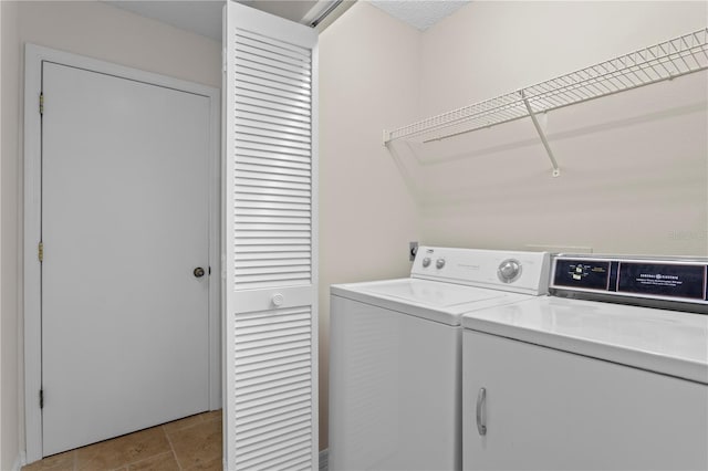 washroom with independent washer and dryer