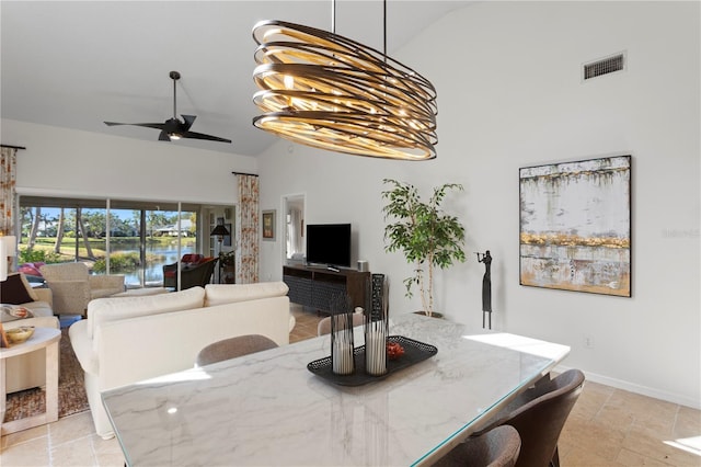 dining room with high vaulted ceiling and ceiling fan