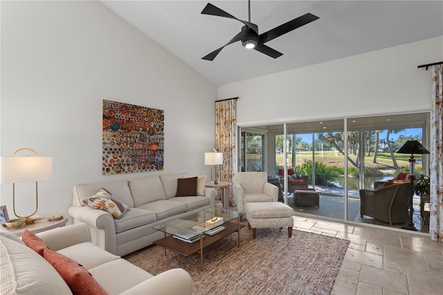 living room featuring ceiling fan and high vaulted ceiling