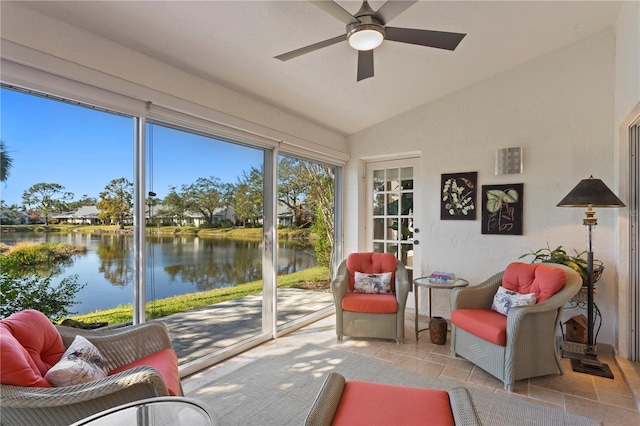 sunroom featuring a water view, ceiling fan, and lofted ceiling