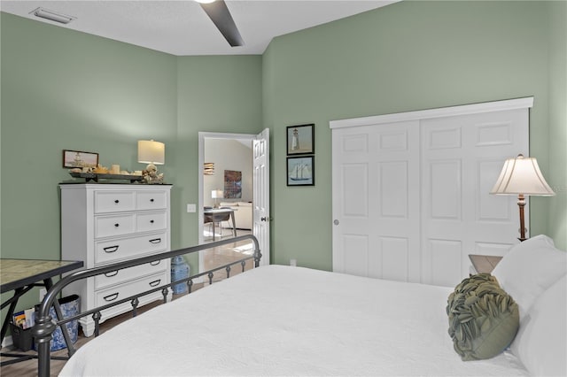 bedroom featuring ceiling fan and a closet