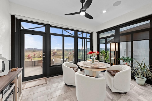 sunroom with ceiling fan