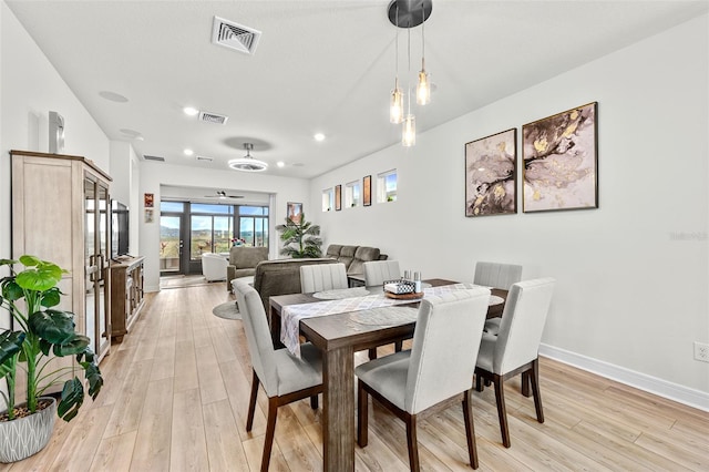 dining room featuring ceiling fan and light wood-type flooring