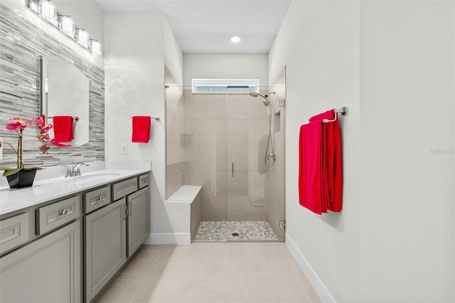 bathroom with vanity, tile patterned flooring, and walk in shower