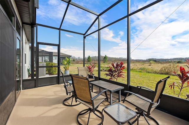 sunroom / solarium featuring a rural view