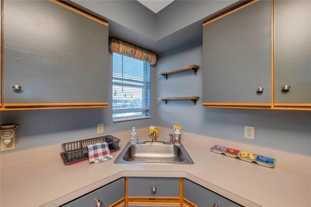 kitchen with gray cabinets and sink