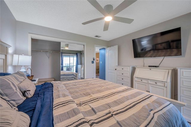 bedroom with ceiling fan and a closet