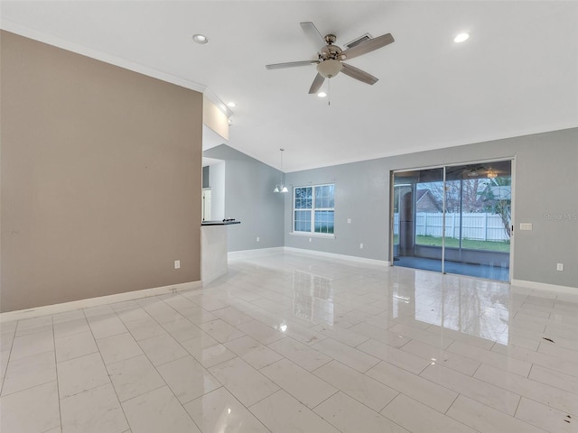 unfurnished room featuring ceiling fan with notable chandelier, vaulted ceiling, and crown molding