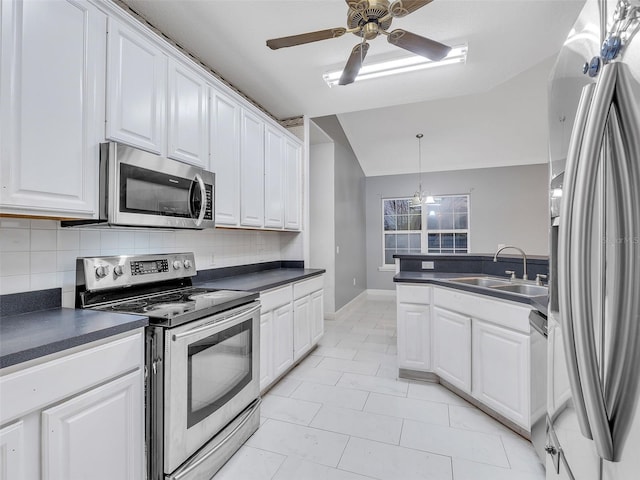 kitchen featuring white cabinets, stainless steel appliances, and sink