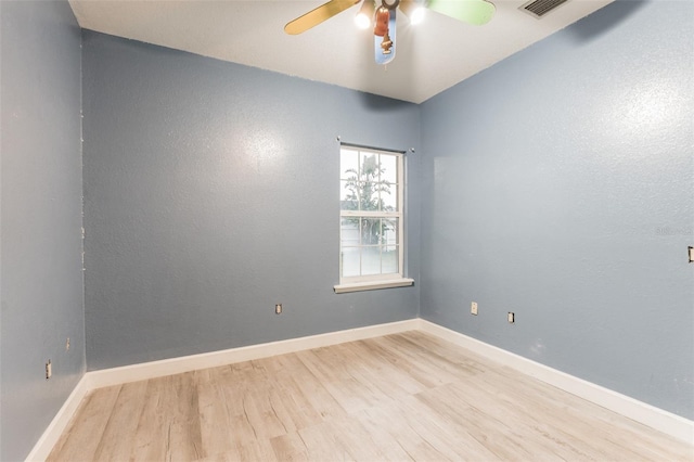 spare room with ceiling fan and light hardwood / wood-style flooring