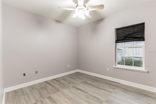 spare room featuring ceiling fan and light hardwood / wood-style floors