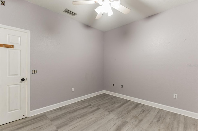 empty room featuring light wood-type flooring and ceiling fan