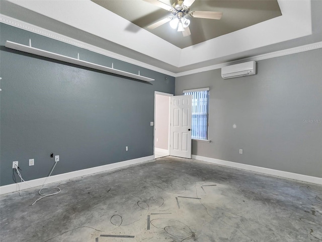 empty room with ceiling fan, a wall unit AC, crown molding, concrete flooring, and a tray ceiling