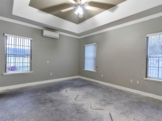 spare room with concrete flooring, a raised ceiling, ceiling fan, crown molding, and an AC wall unit