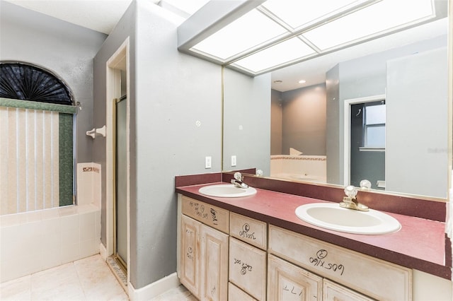 bathroom with tile patterned floors, vanity, and a shower with shower door