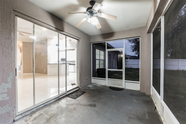 interior space with ceiling fan