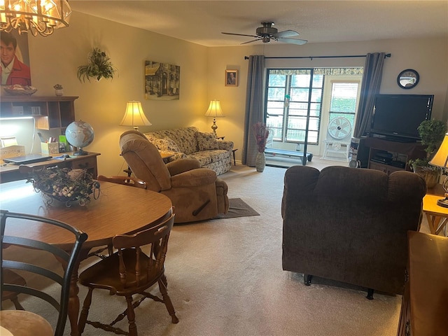 living room with ceiling fan with notable chandelier and light carpet