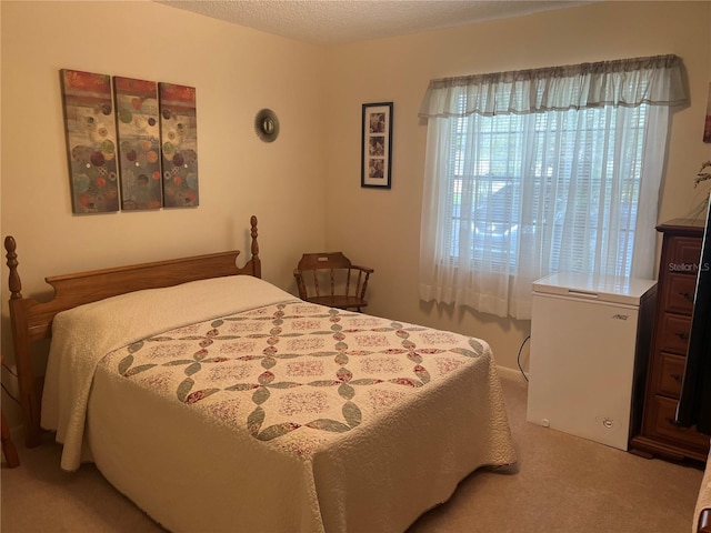 carpeted bedroom featuring fridge