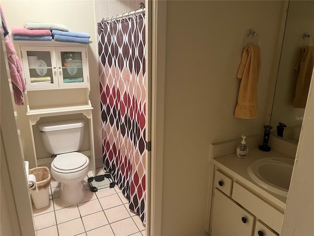 bathroom with vanity, a shower with shower curtain, tile patterned flooring, and toilet