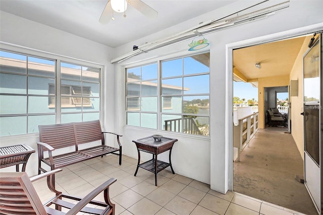 sunroom / solarium with ceiling fan