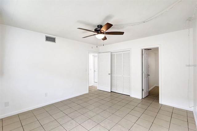 unfurnished bedroom featuring a closet and ceiling fan