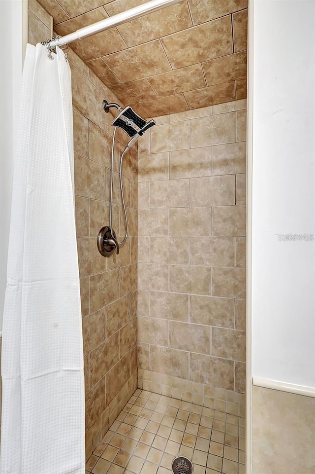 bathroom with a shower with shower curtain