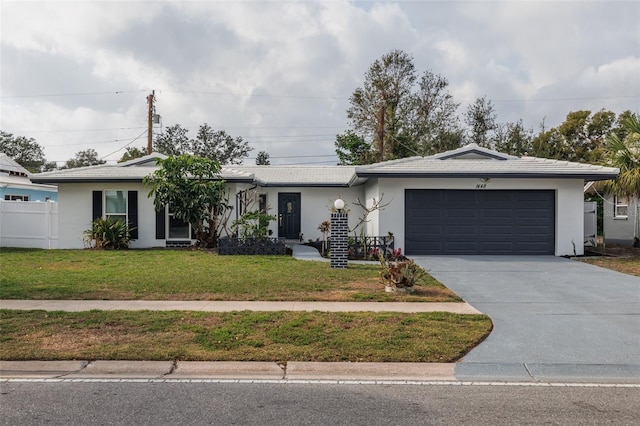 single story home featuring a garage and a front yard