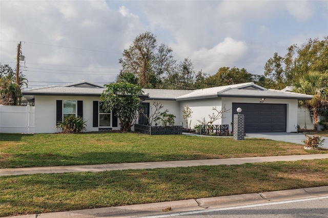 single story home with a front yard and a garage