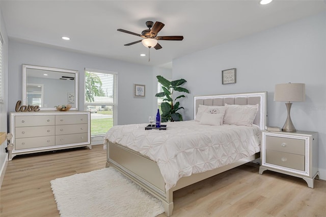 bedroom featuring ceiling fan and light hardwood / wood-style flooring