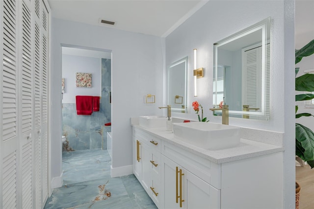 bathroom with vanity and toilet