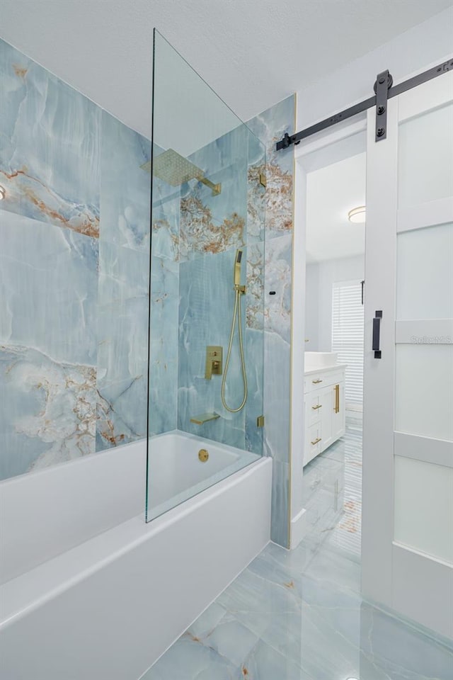 bathroom featuring vanity and tiled shower / bath combo