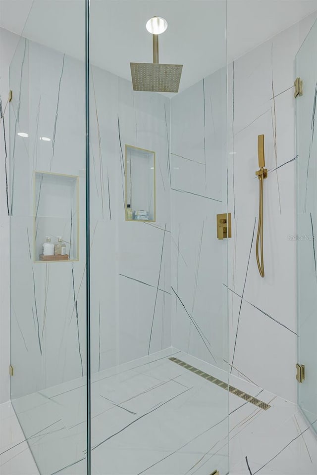 bathroom with a tile shower