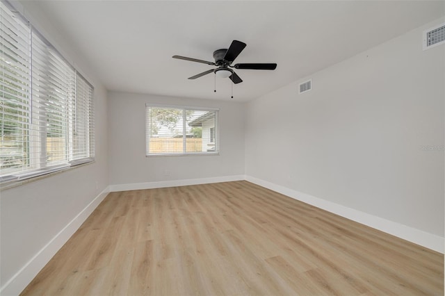 spare room featuring ceiling fan and light wood-type flooring