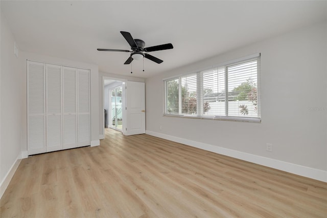 unfurnished bedroom featuring ceiling fan, light hardwood / wood-style floors, and a closet