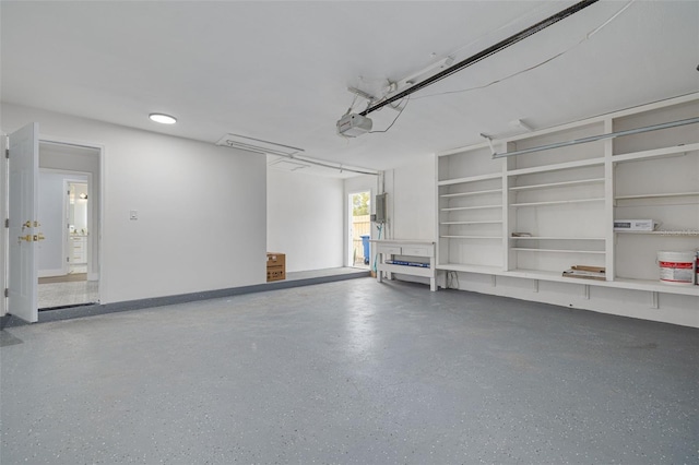 garage featuring a garage door opener and electric panel