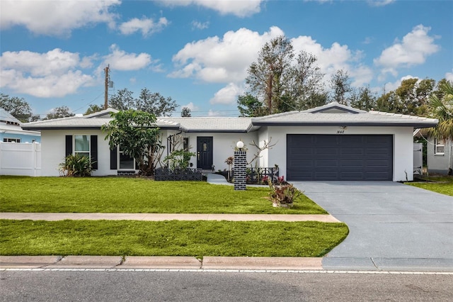 single story home with a garage and a front yard