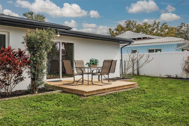 rear view of property with a lawn