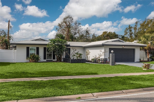 ranch-style house with a garage and a front yard