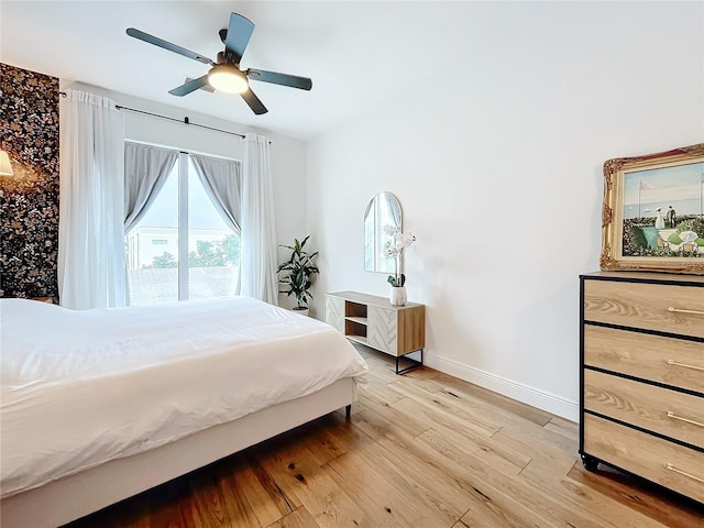 bedroom featuring ceiling fan and light wood-type flooring