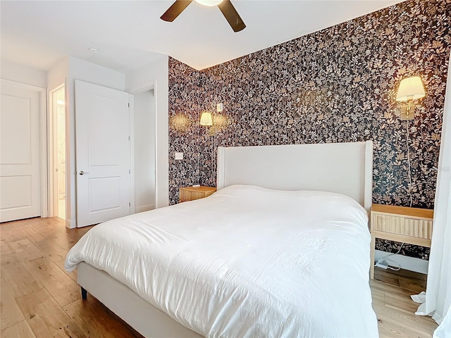 bedroom featuring hardwood / wood-style floors and ceiling fan