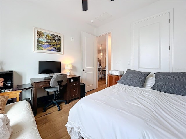 bedroom featuring ceiling fan and light hardwood / wood-style flooring