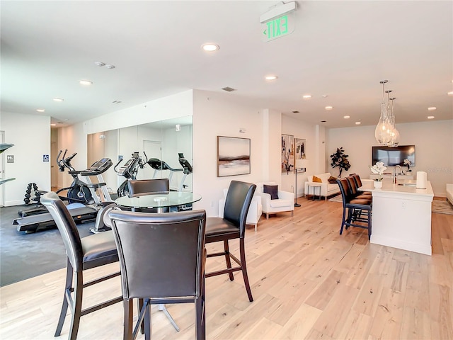 dining area featuring recessed lighting and light wood-style flooring