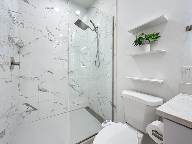 full bath with toilet, a marble finish shower, and vanity