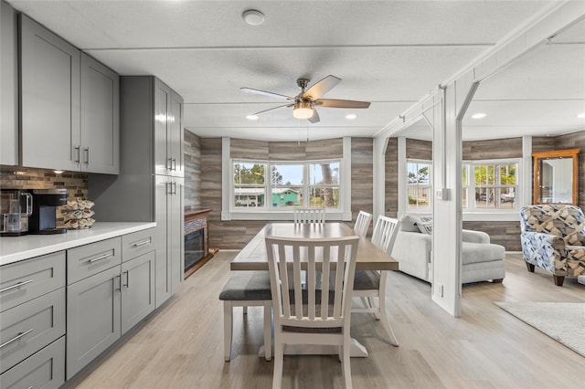 dining area with ceiling fan, plenty of natural light, and light wood-type flooring