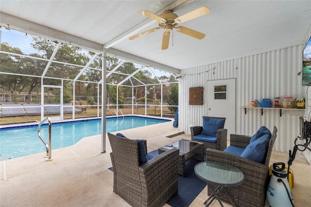 view of swimming pool featuring a patio, an outdoor hangout area, and a lanai