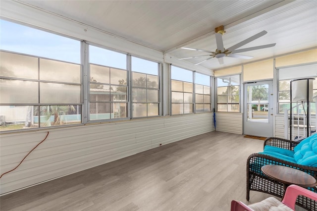 sunroom featuring ceiling fan and a healthy amount of sunlight