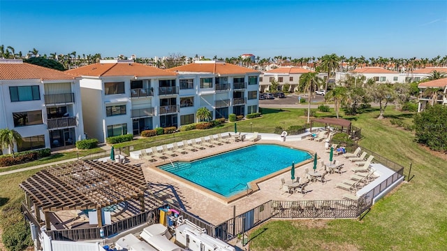 view of swimming pool featuring a patio area and a lawn