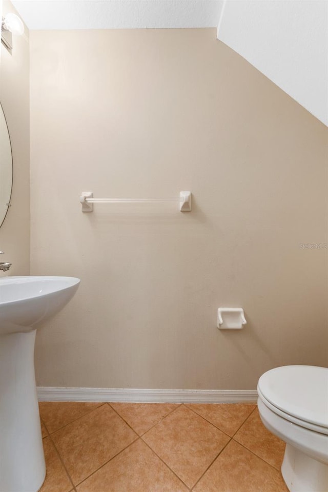 bathroom featuring tile patterned flooring and toilet