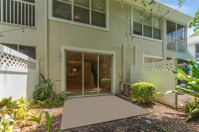 doorway to property with cooling unit