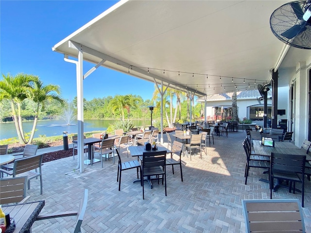 view of patio with a water view